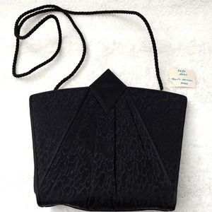 VINTAGE NEVER USED HANDBAG.  BLACK GEOMETRIC SHAPE